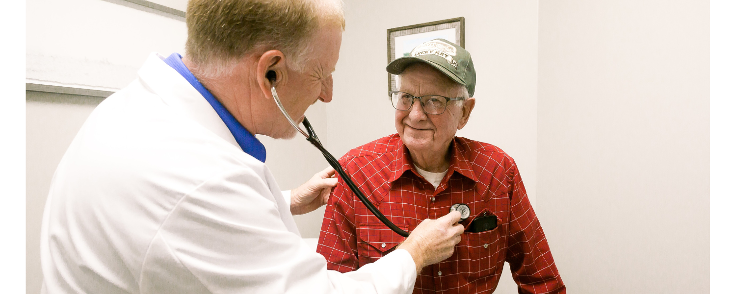 nurse talking with elderly patient 